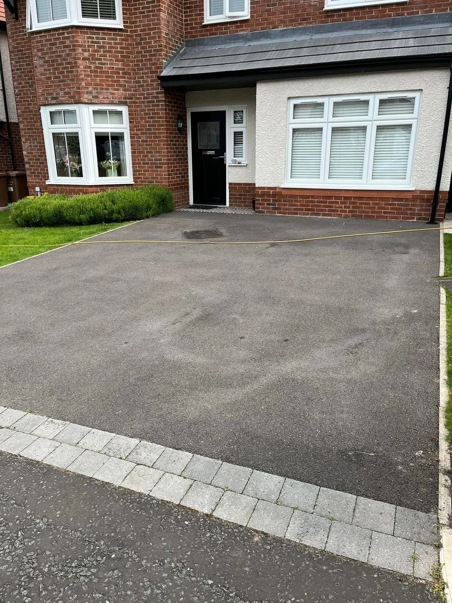 Driveway before cleaning — faded, worn tarmac