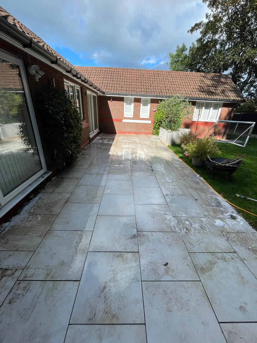 Patio before pressure washing — dirty, stained slabs